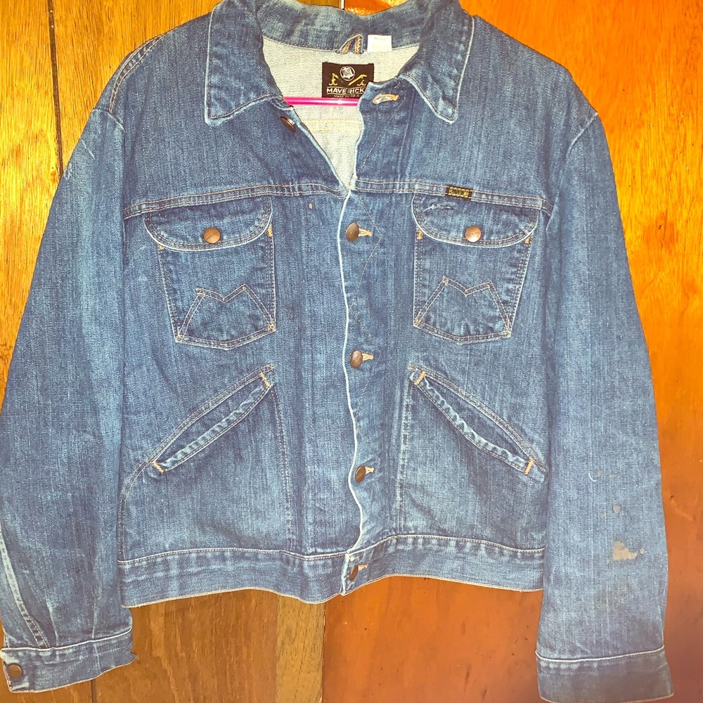 Medium blue jean jacket with paint design on back